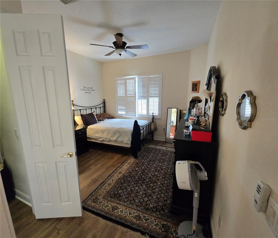 19153 Geraci Road Lutz, FL 33558 - Photo 12 of 21 a bedroom with bed or couch and a window