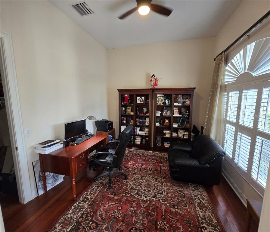 19153 Geraci Road Lutz, FL 33558 - Photo 13 of 21 a living room with furniture a rug and a window
