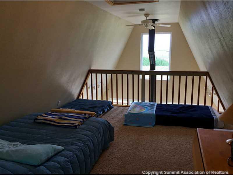 1469 Sheep Ridge Road Fairplay, CO 80440 - Photo 15 of 20 a backyard of a house with wooden floor
