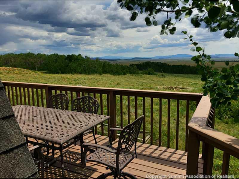 1469 Sheep Ridge Road Fairplay, CO 80440 - Photo 3 of 20 a view of a balcony with wooden floor and outdoor seating