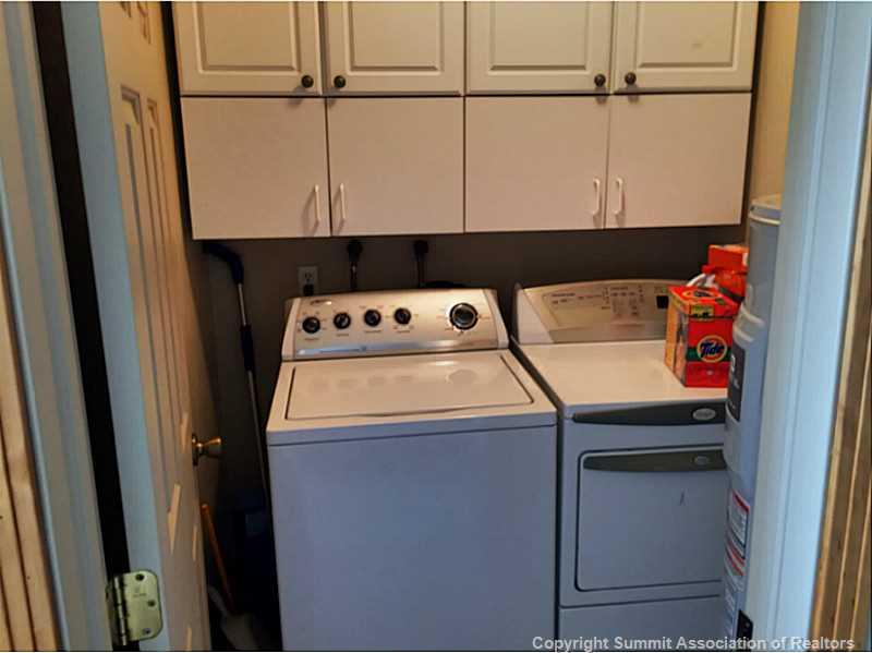 1469 Sheep Ridge Road Fairplay, CO 80440 - Photo 7 of 20 a utility room with dryer and washer