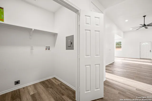 a view of hallway with wooden floor