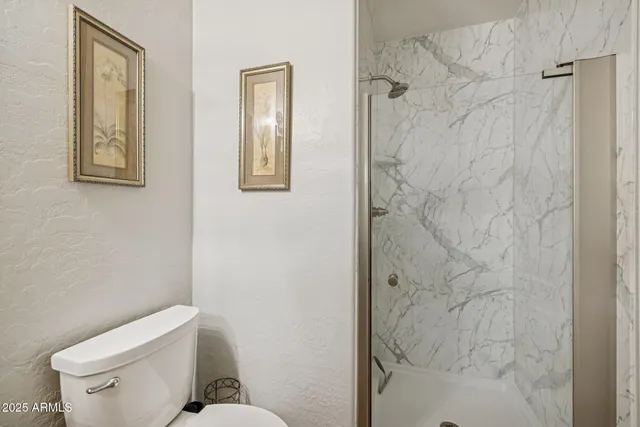 a bathroom with a bathtub a sink and a window