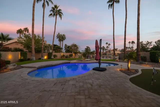 a view of a house with backyard and porch
