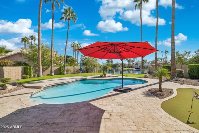 a view of street with tall buildings and a big yard