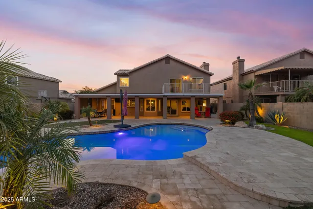 an aerial view of a house with a lake view