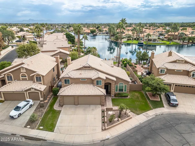 an aerial view of a house with lake view