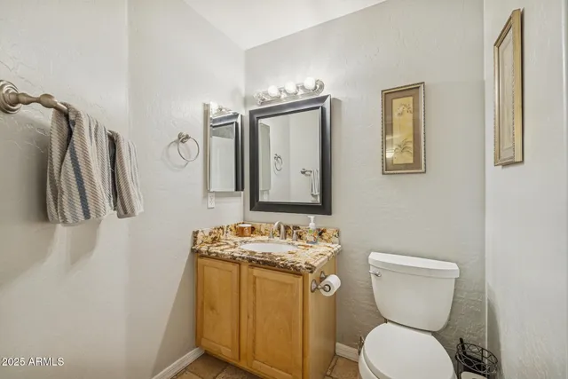 an aerial view of a residential houses with outdoor space and street view