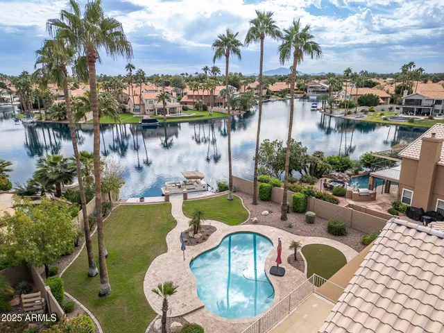 a bathroom with a granite countertop sink mirror and shower