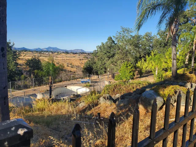 a view of swimming pool from a balcony