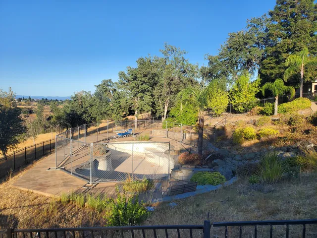 a view of a swimming pool with an outdoor space and seating area