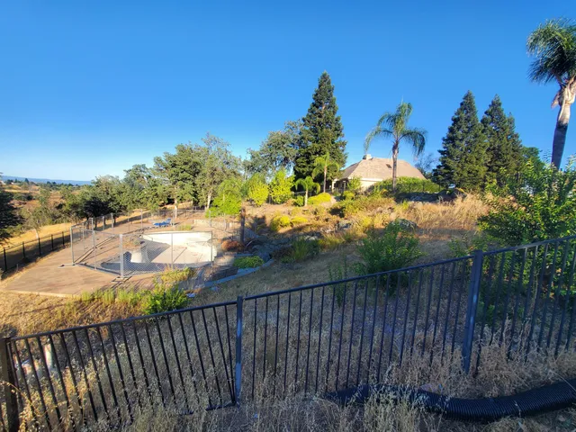 a view of a pathway of a yard and outside of the house