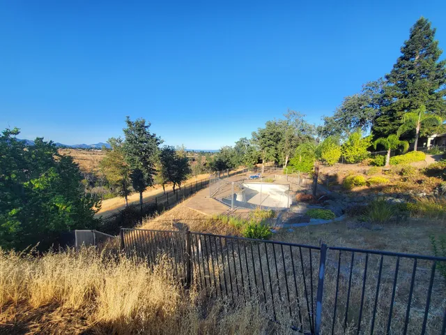 a view of swimming pool from a balcony