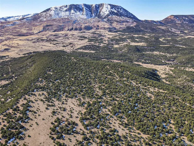a view of mountains and valleys