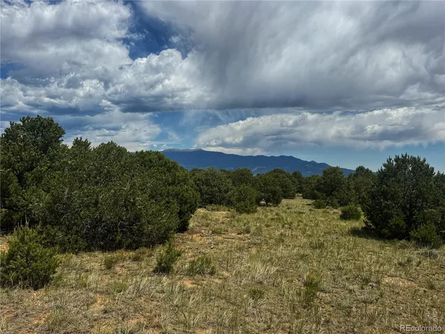 a view of mountain with sunset