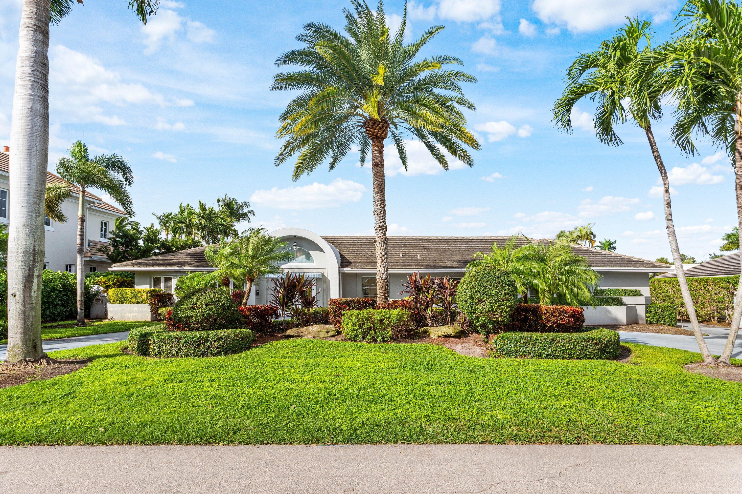 2041 Thatch Palm Drive Boca Raton, FL 33432 - Photo 11 of 45 a view of a house with a yard and potted plants