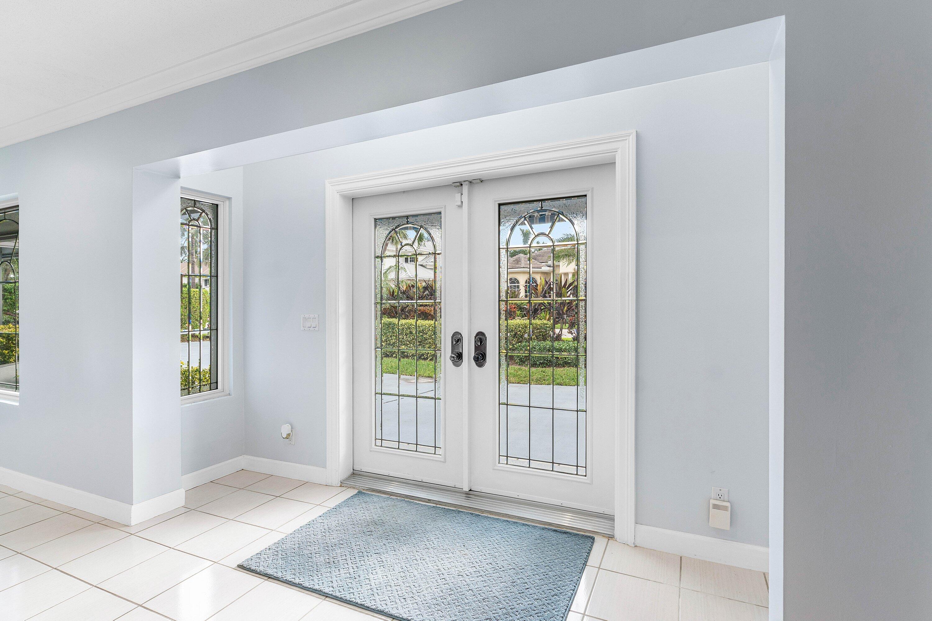 2041 Thatch Palm Drive Boca Raton, FL 33432 - Photo 16 of 45 wooden floor in an empty room with a window