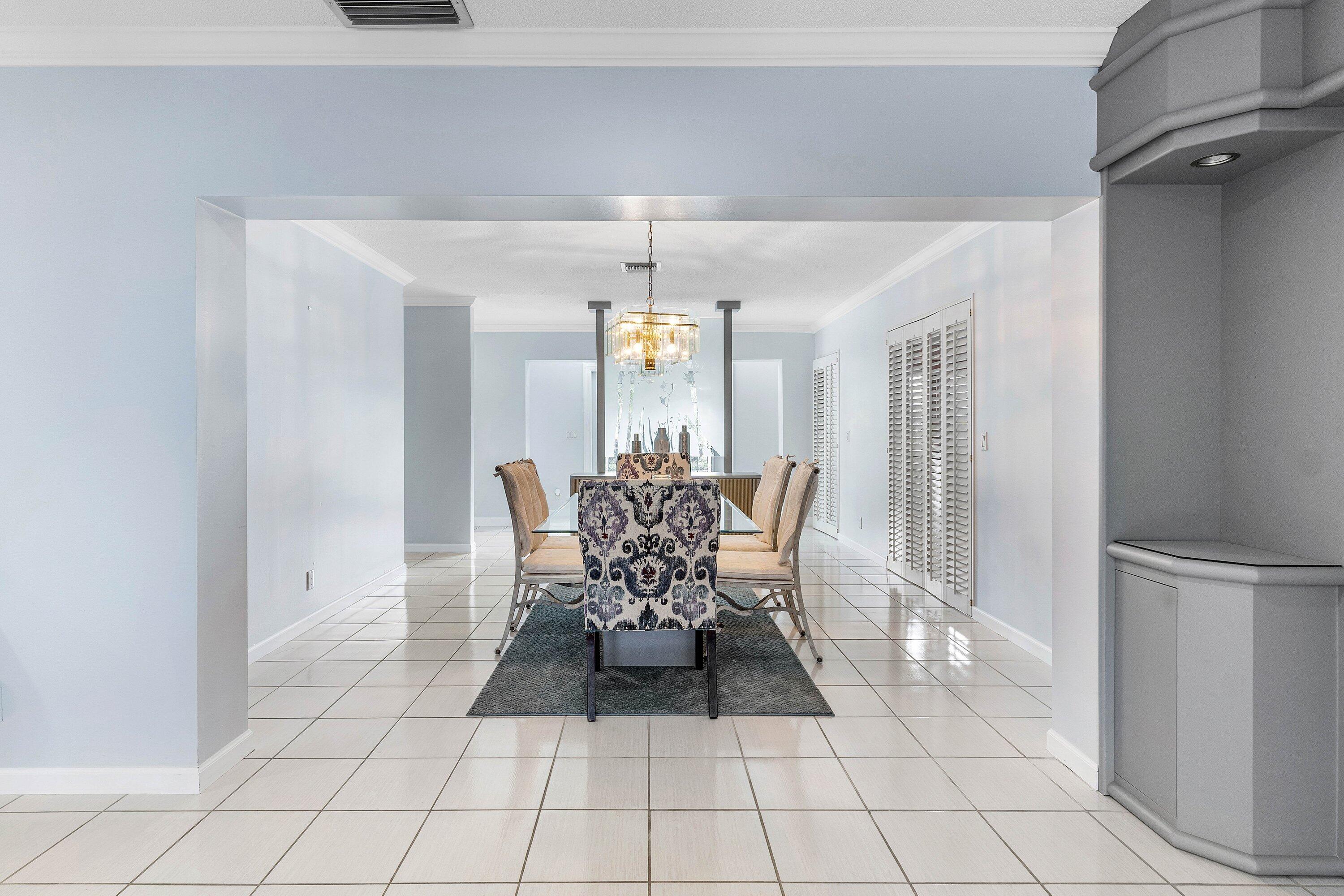 2041 Thatch Palm Drive Boca Raton, FL 33432 - Photo 20 of 45 a view of a dining room with furniture and chandelier