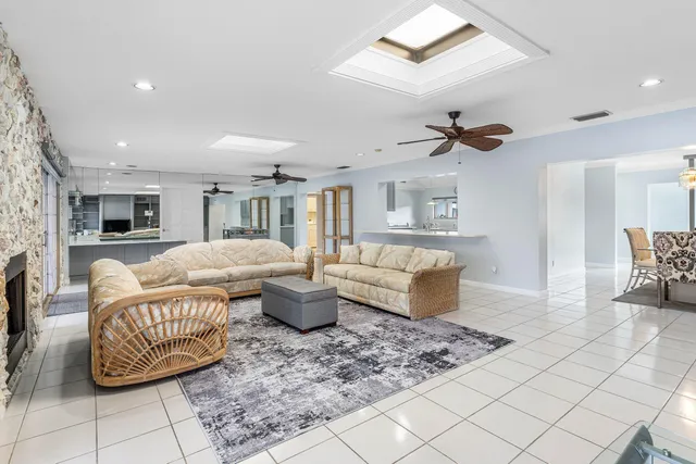 a bedroom with furniture and a large window