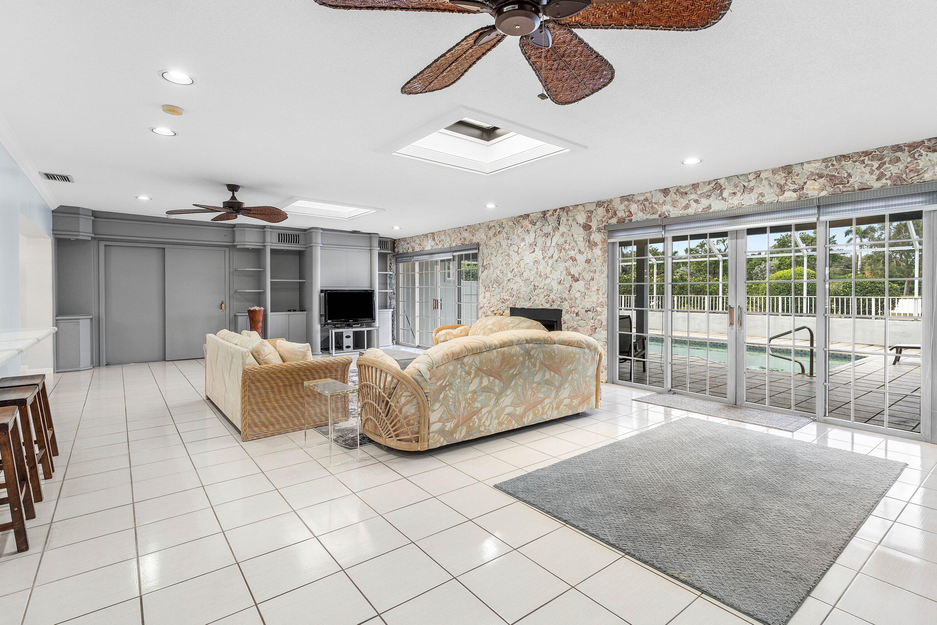 2041 Thatch Palm Drive Boca Raton, FL 33432 - Photo 23 of 45 a bedroom with furniture and a large window