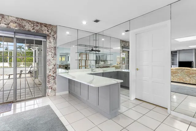 a kitchen with a table and chairs in it