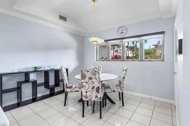 a kitchen that has a sink in it and white appliances