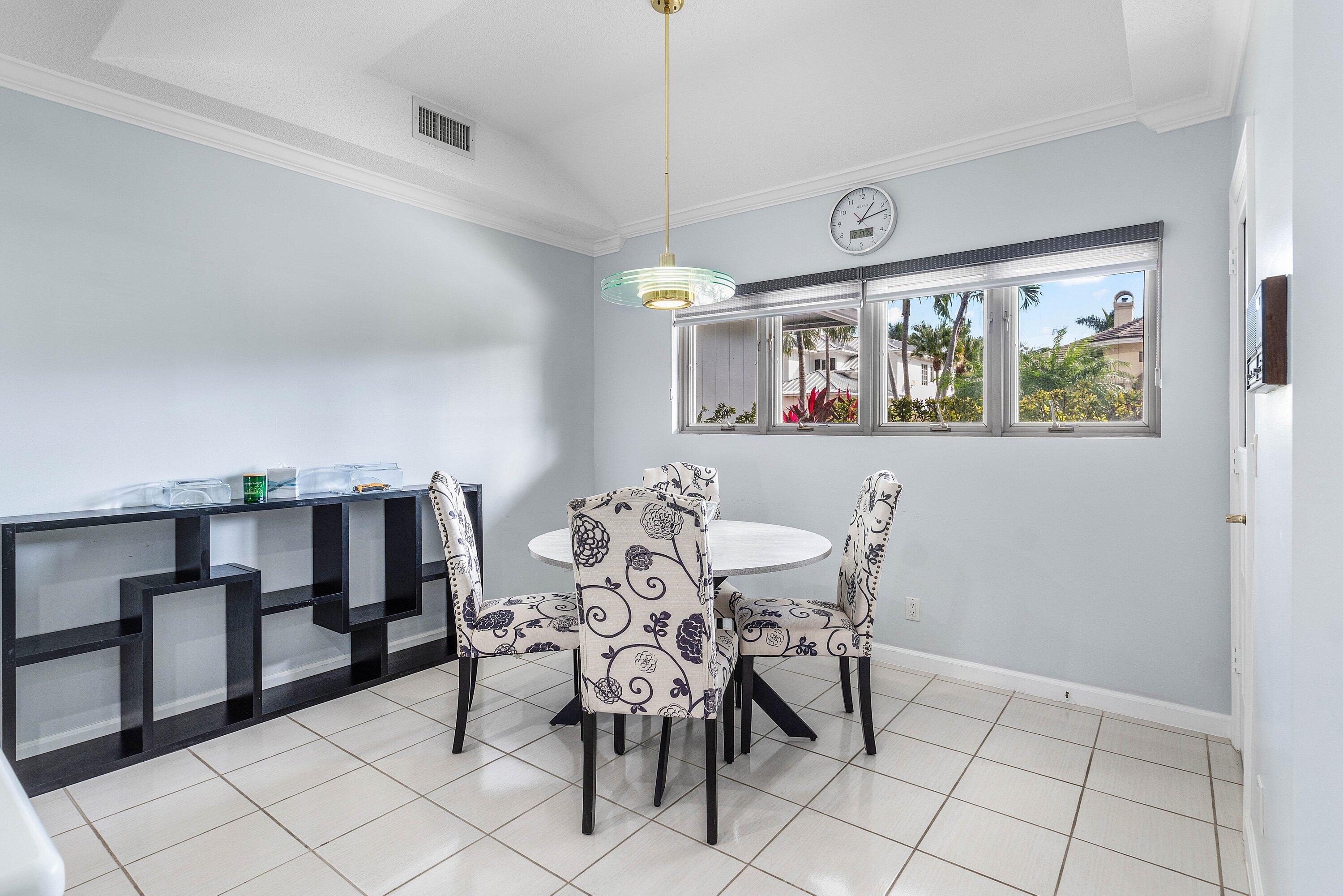 2041 Thatch Palm Drive Boca Raton, FL 33432 - Photo 28 of 45 a view of a dining room with furniture