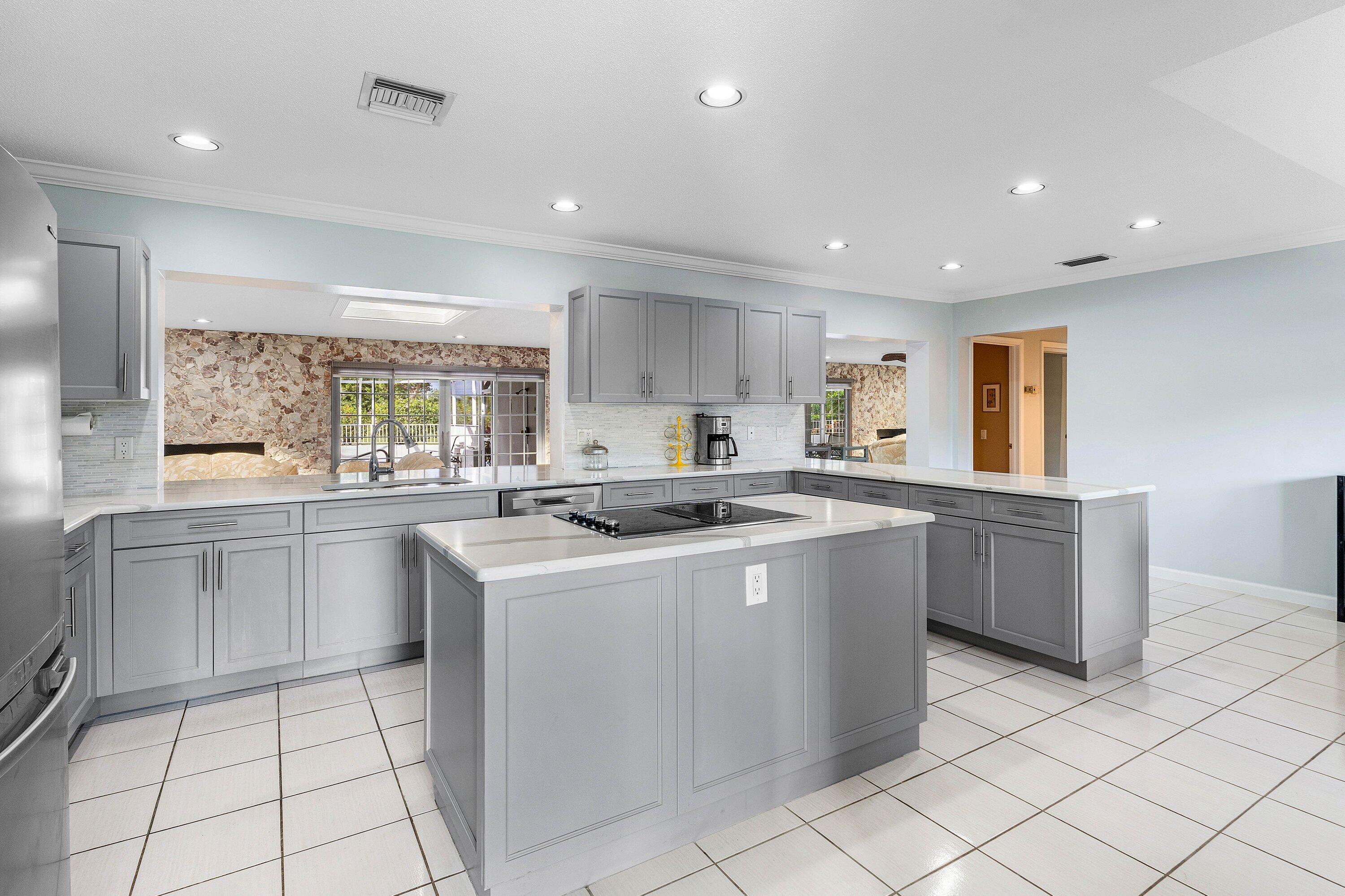 2041 Thatch Palm Drive Boca Raton, FL 33432 - Photo 29 of 45 a kitchen with a sink window and cabinets