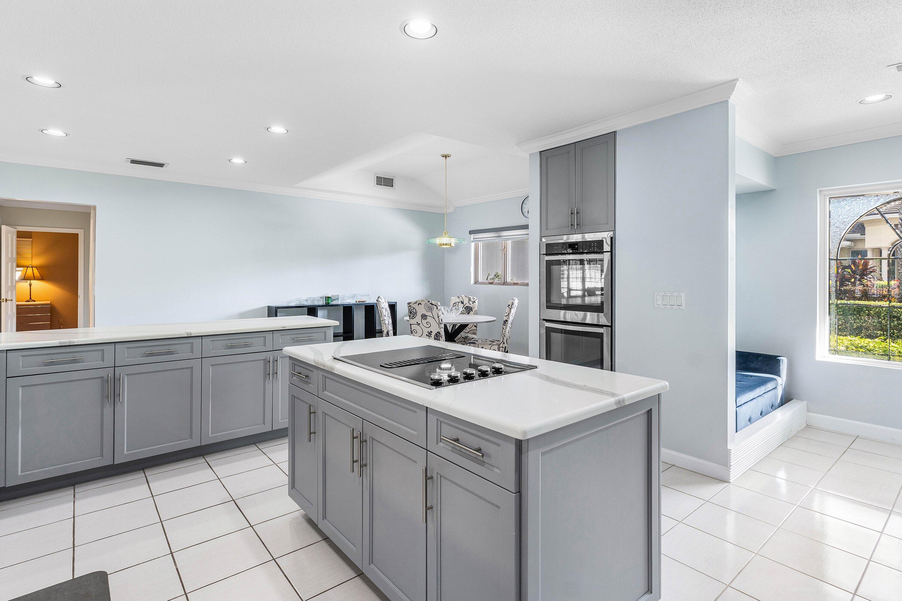 2041 Thatch Palm Drive Boca Raton, FL 33432 - Photo 30 of 45 a kitchen that has a sink in it and white appliances