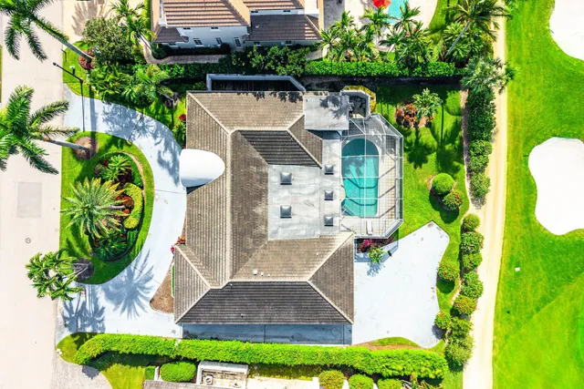 a aerial view of a house with a yard