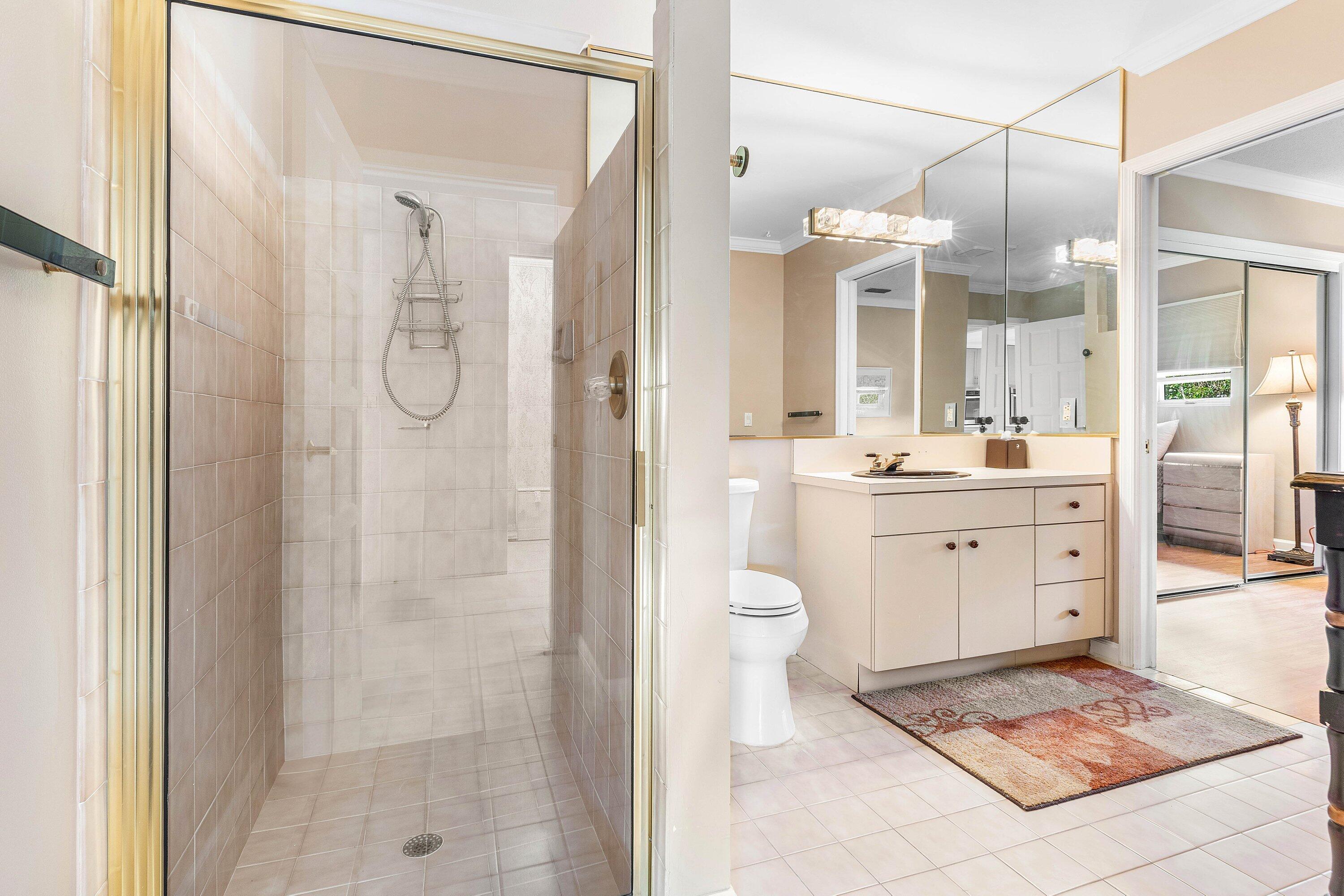 2041 Thatch Palm Drive Boca Raton, FL 33432 - Photo 31 of 45 a bathroom with a sink a toilet and shower