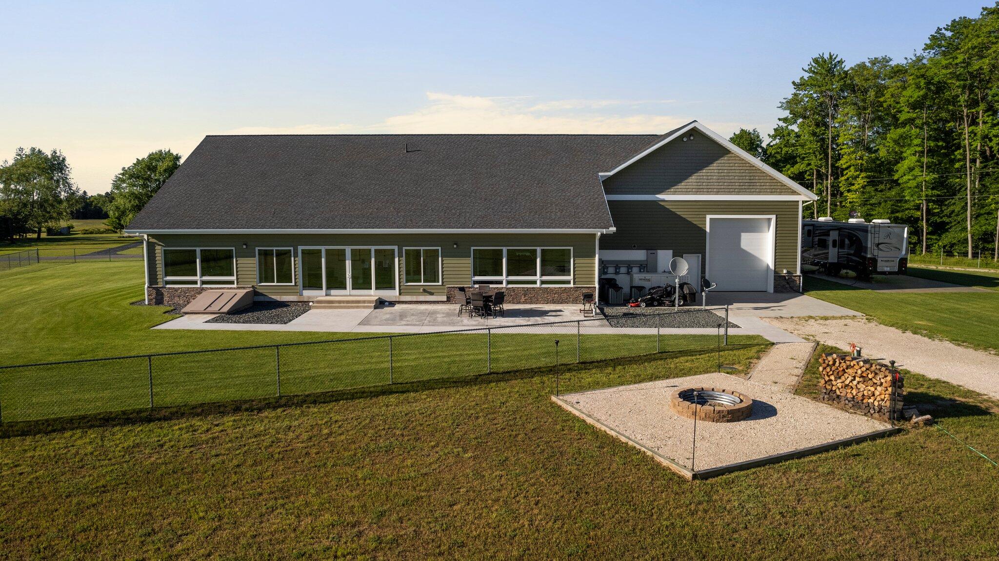 5859 Potter Road Onekama, MI 49675 - Photo 61 of 85 Southern exposure back view of home