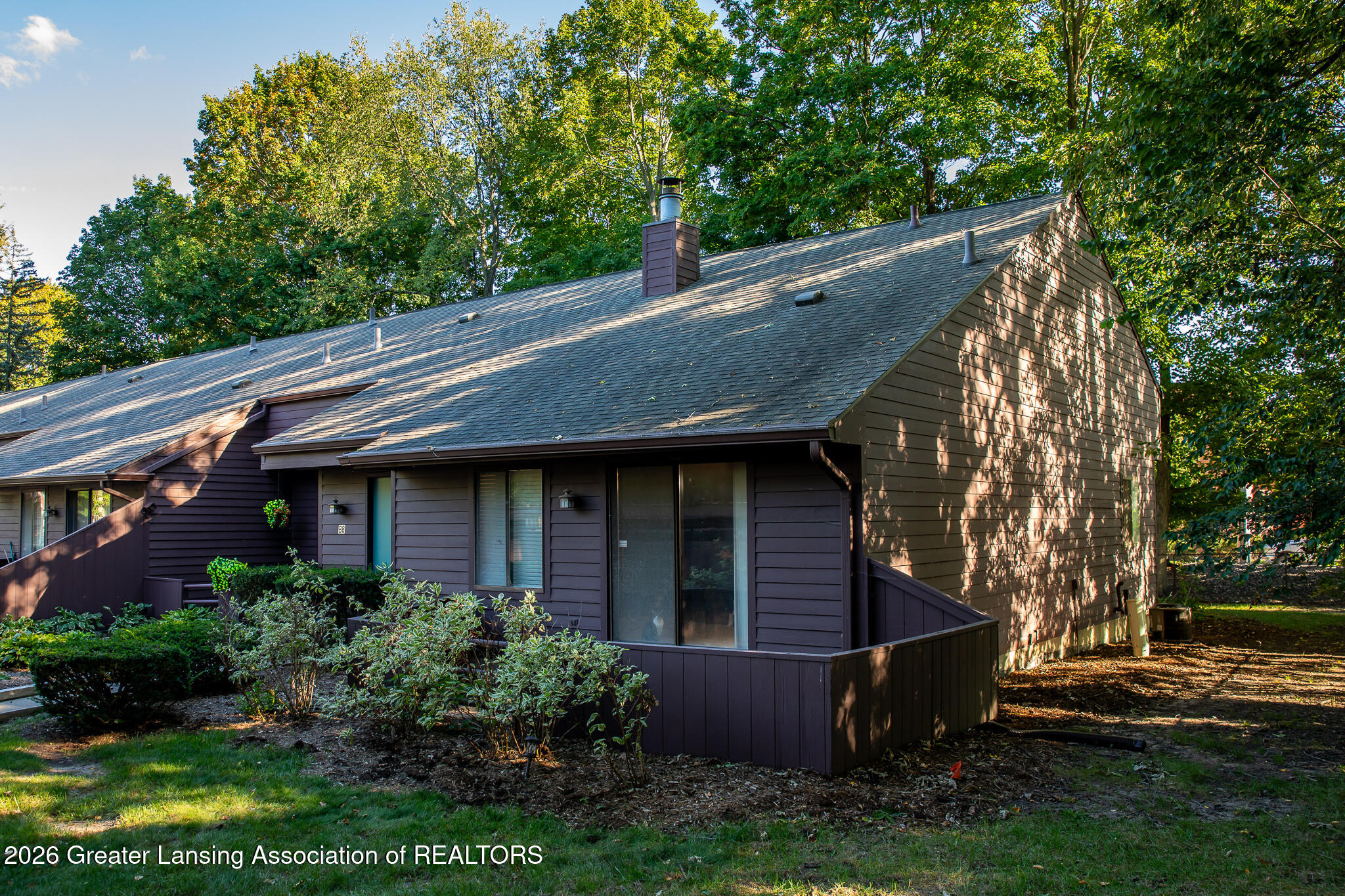 101 East Jolly Road, Unit B8 24 Lansing, MI 48910 - Photo 39 of 43 Side view of home- End unit!