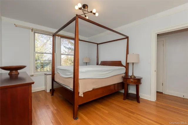 a bedroom with a bed and a lamp on table