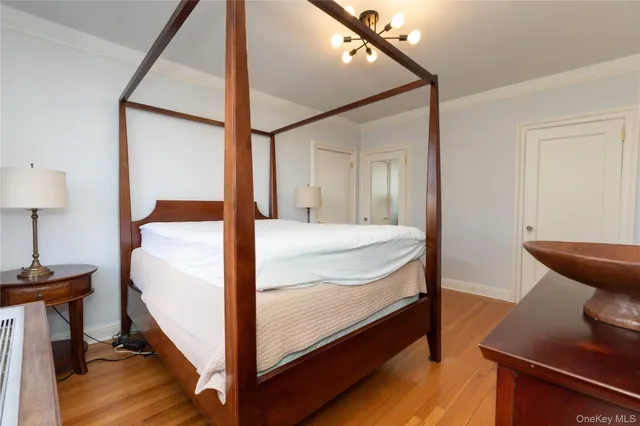 a view of swimming pool with outdoor seating and trees in the background