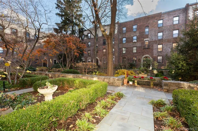 a view of a park with swings and slides