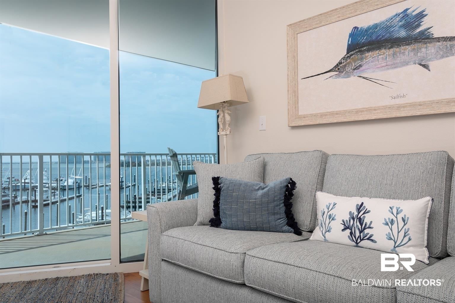 27800 Canal Road, Unit 411 Orange Beach, AL 36561 - Photo 4 of 49 Floor-to-ceiling glass sliding doors open to a balcony with a marina panorama