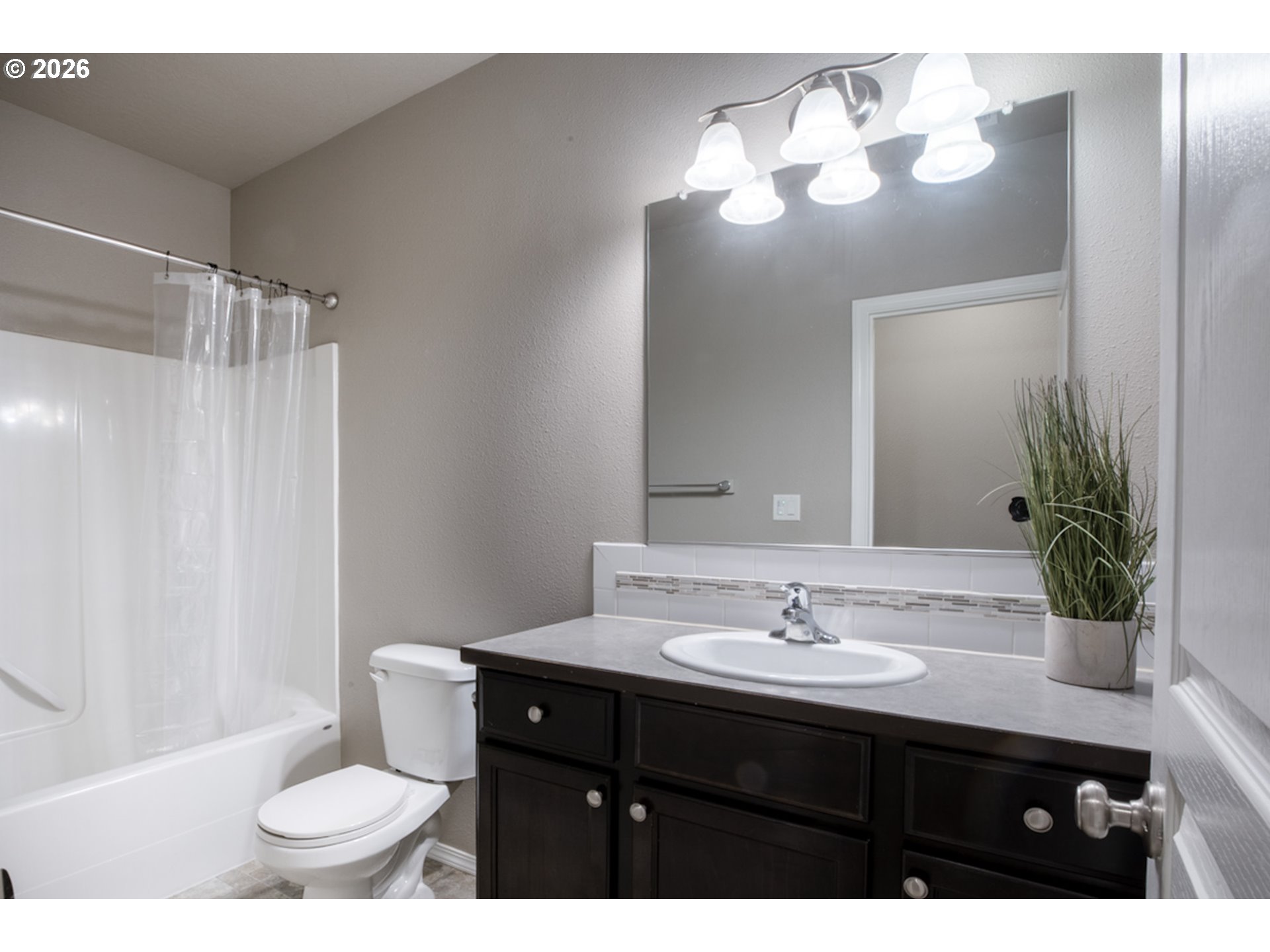 2952 Shelby Way Eugene, OR 97404 - Photo 12 of 25 a bathroom with a sink toilet and a mirror