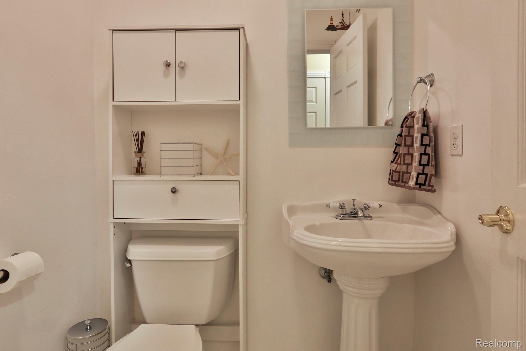 8356 Rucker Road Grosse Ile, MI 48138 - Photo 14 of 26 Main floor powder room.