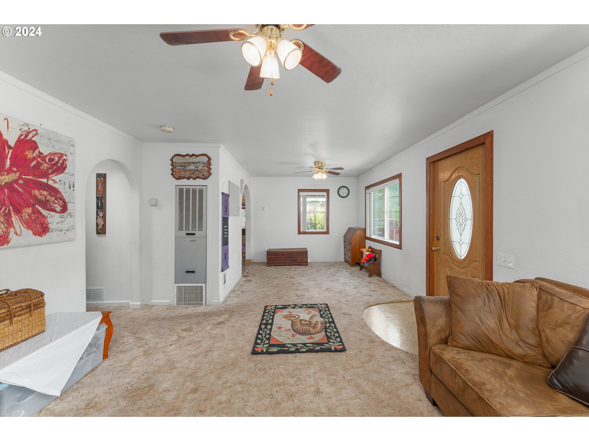 215 Northside Road Sutherlin, OR 97479 - Photo 11 of 40 a living room with furniture and a flat screen tv