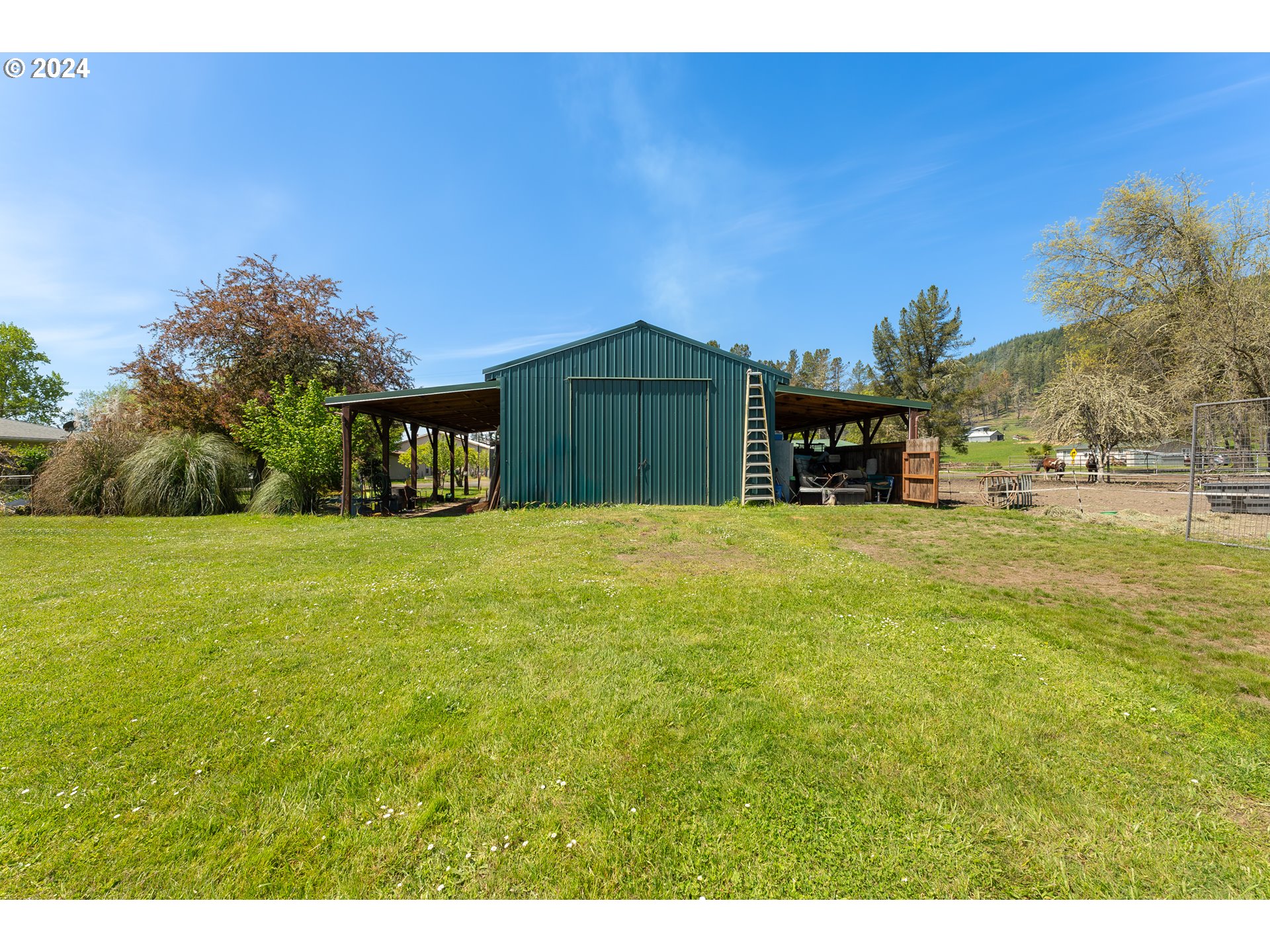 215 Northside Road Sutherlin, OR 97479 - Photo 21 of 40 a view of a house with a yard