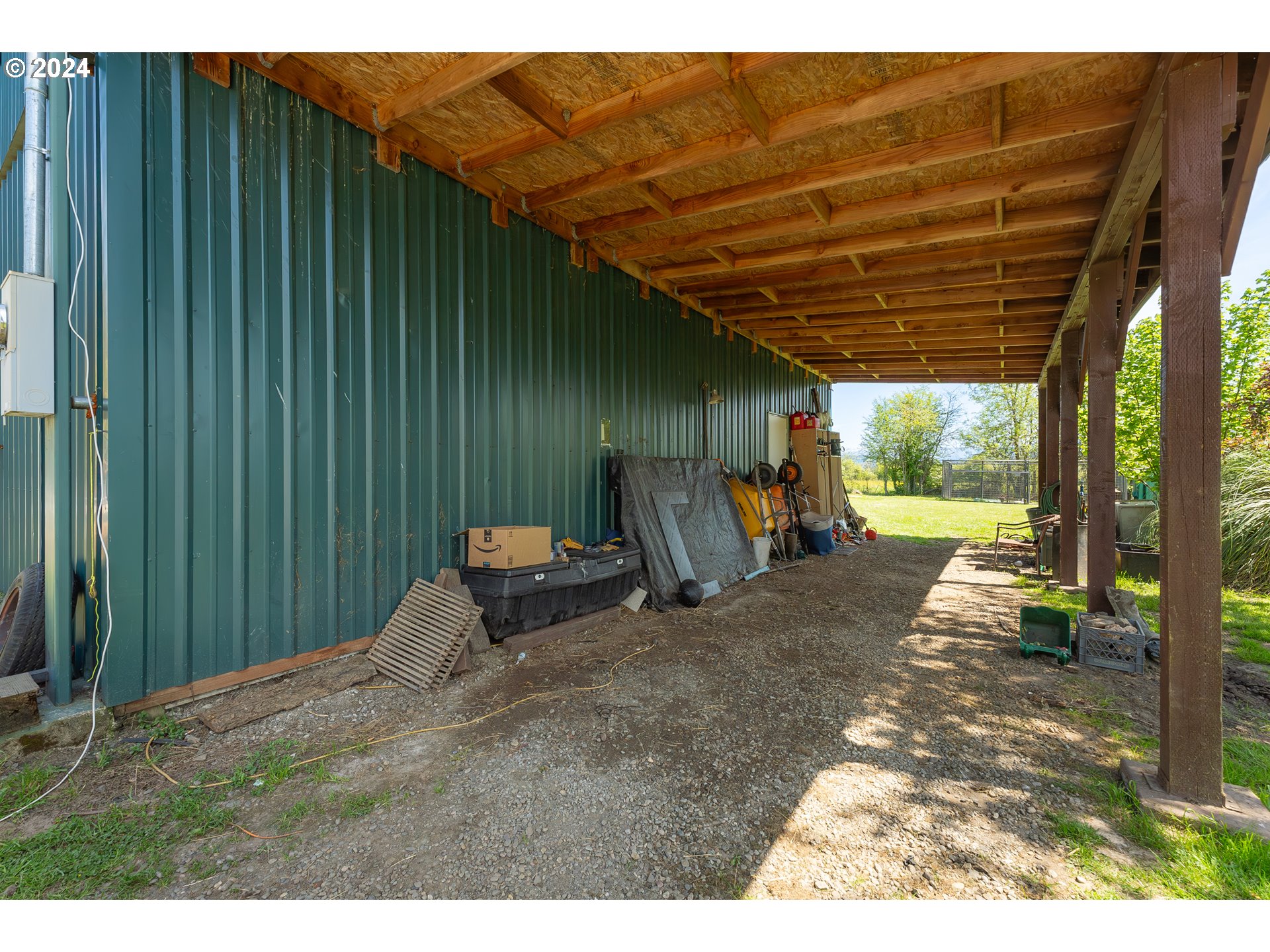 215 Northside Road Sutherlin, OR 97479 - Photo 23 of 40 a backyard of a house with barbeque oven table and chairs