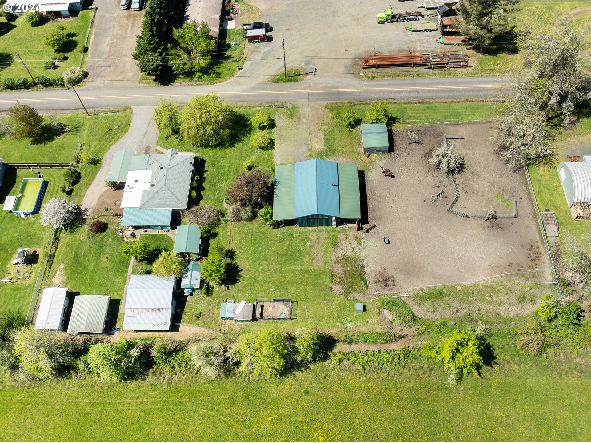 215 Northside Road Sutherlin, OR 97479 - Photo 37 of 40 an aerial view of residential houses with outdoor space and swimming pool