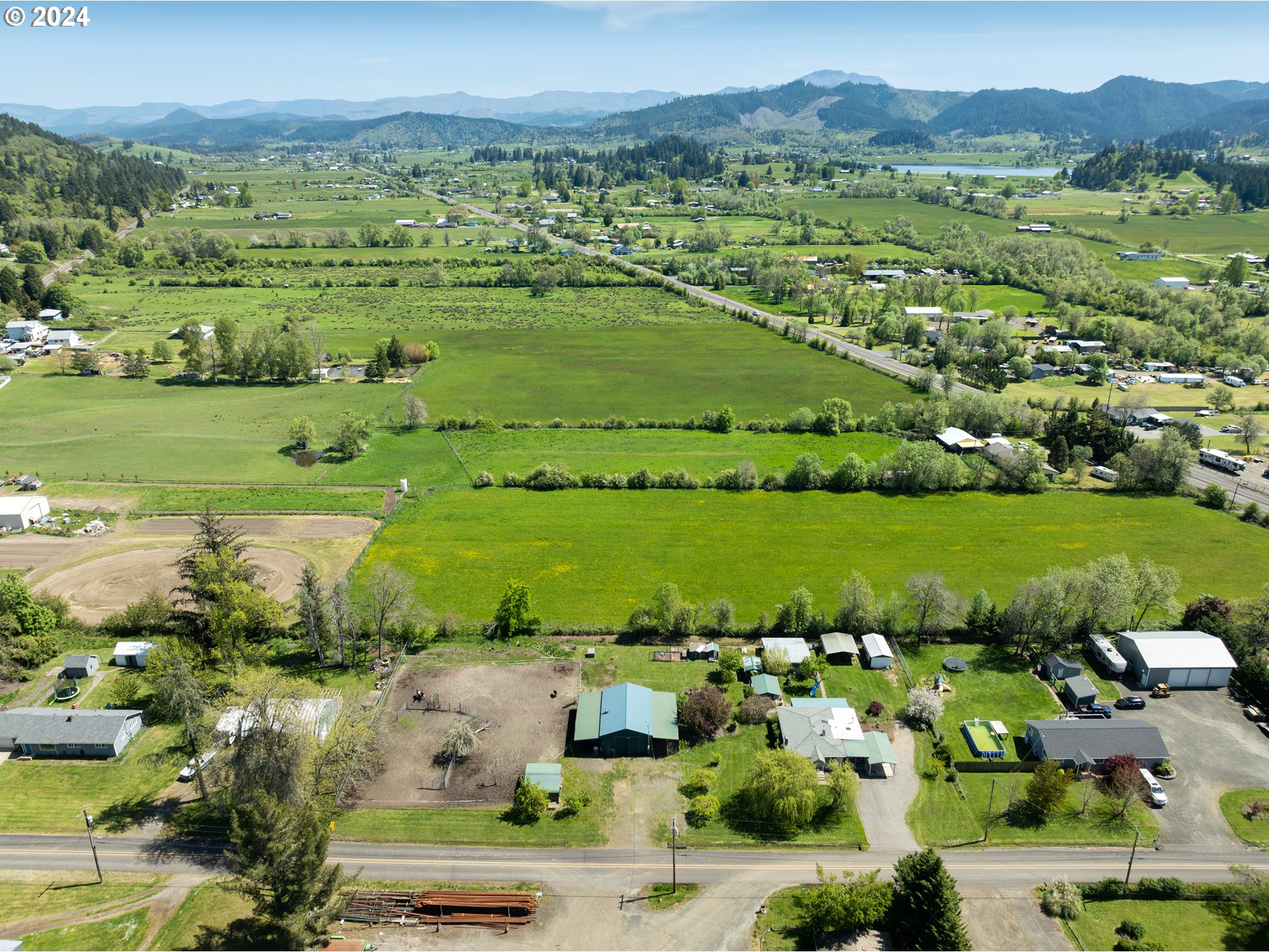 215 Northside Road Sutherlin, OR 97479 - Photo 7 of 40 an aerial view of a city with lots of residential buildings