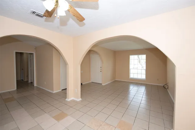 a view of a hallway with windows
