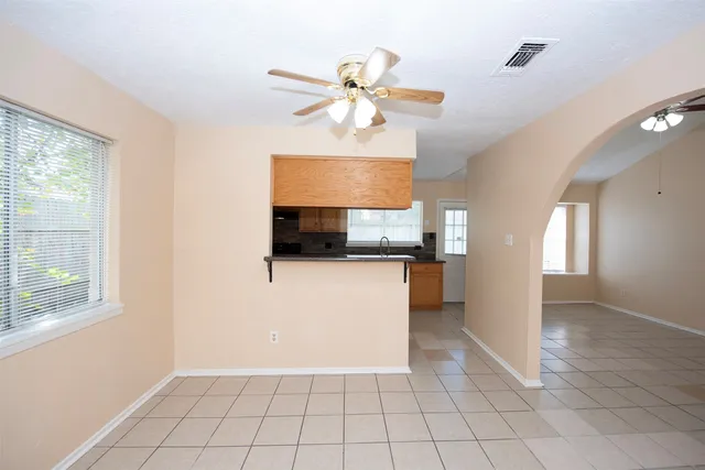 a kitchen that has a sink and a stove