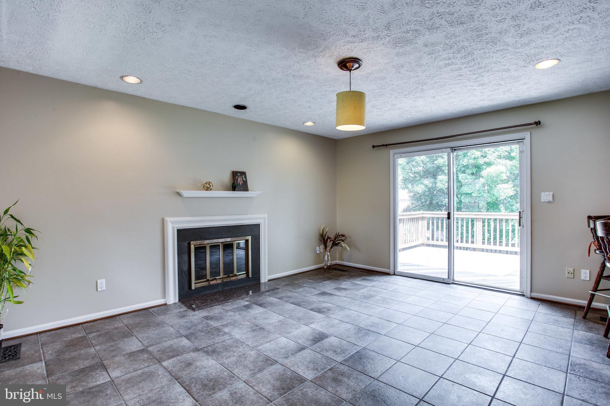 1211 Summit Road McLean, VA 22101 - Photo 15 of 50 Another Wood Burning Fireplace and Deck Access