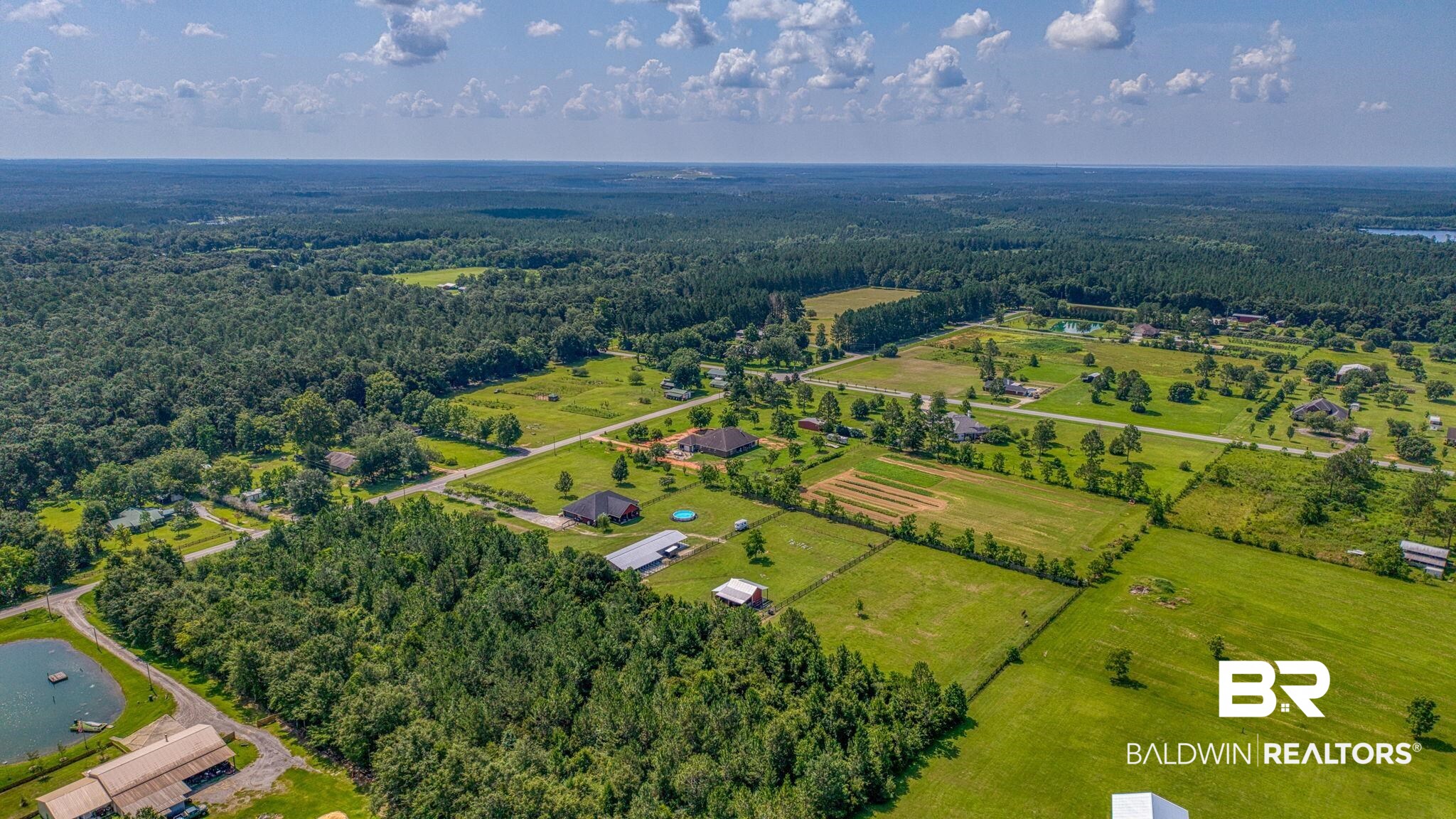 26895 C R Watson Road Robertsdale, AL 36567 - Photo 83 of 89 Expansive land parcel featuring a mixture of wooded areas and cleared green spaces