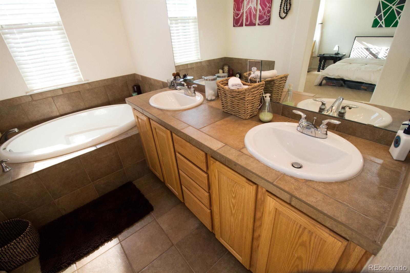 3491 Cascina Place, Unit D Highlands Ranch, CO 80126 - Photo 16 of 22 a bathroom with a sink and a mirror