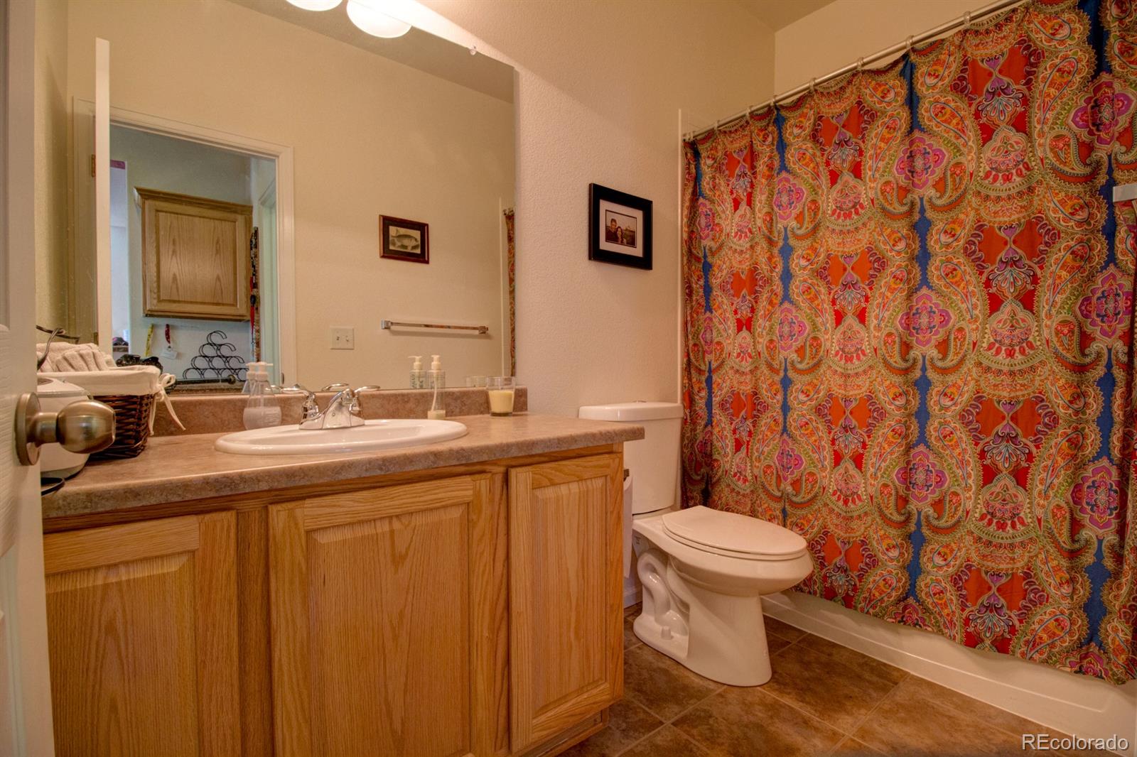 3491 Cascina Place, Unit D Highlands Ranch, CO 80126 - Photo 18 of 22 a bathroom with a sink and a toilet